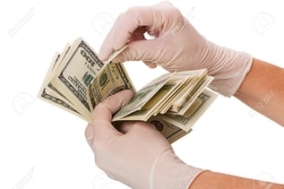 surgical gloves and cash