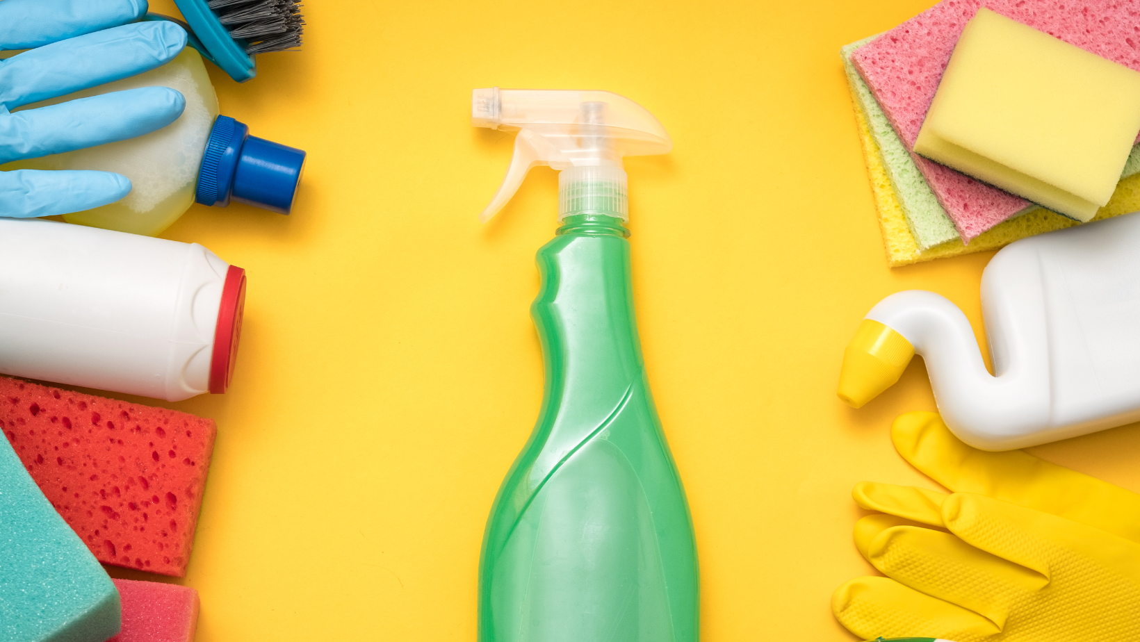 Cleaning supplies laid out across table